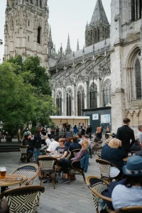 Outdoor cafe on town square with church behind
