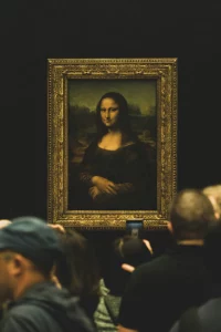 People admiring painting of Mona Lisa