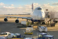 Airplane being loaded on runway