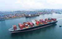 Freight ship sailing near port