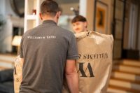 People moving packaged furniture