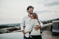 Couple hugging on a rooftop terrace