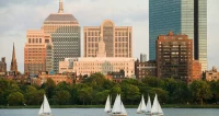The Boston skyline with sailboats on the Charles River in the foreground